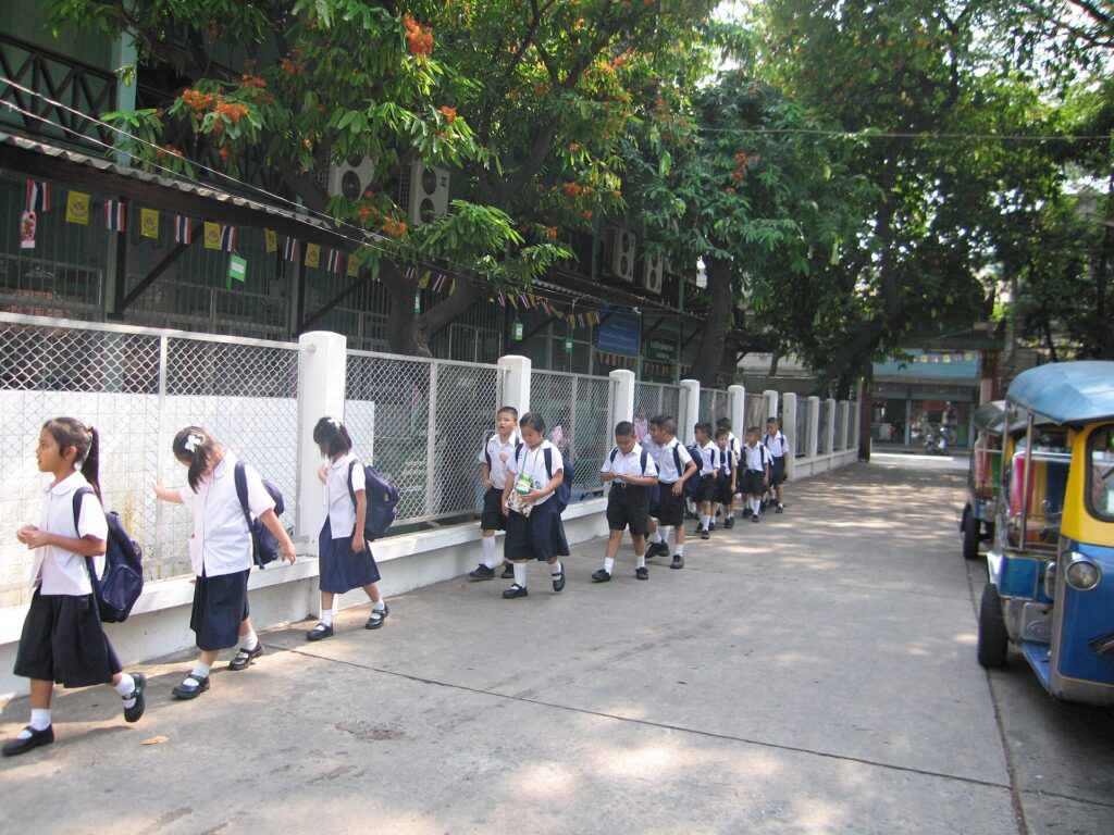 Thai students return from their lunch break.